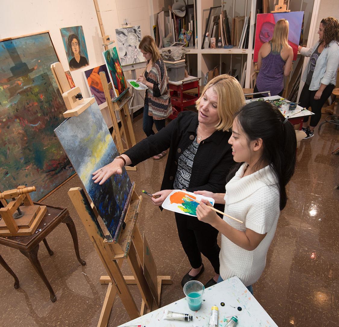 professor with student in art studio